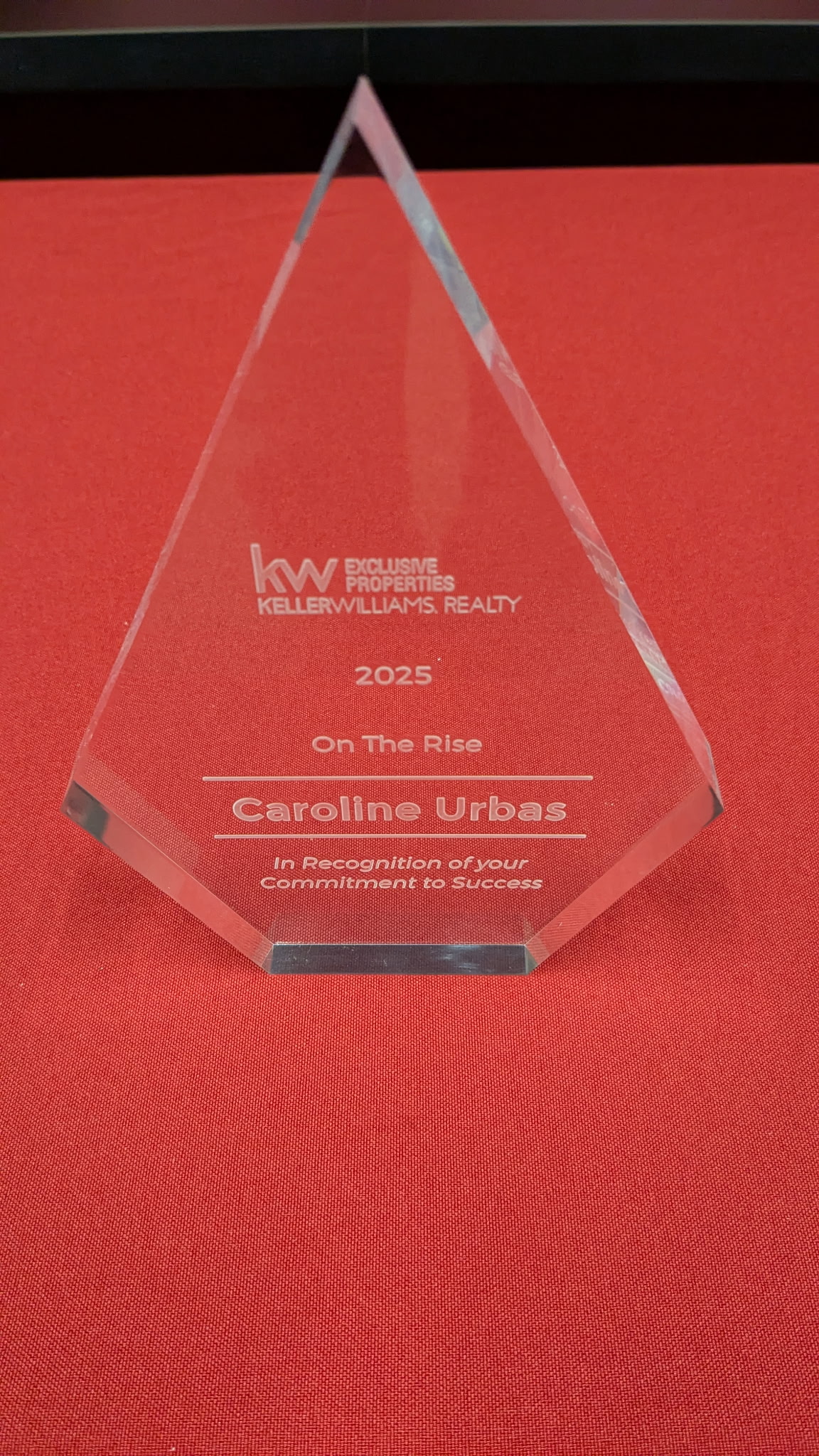 Keller Williams Exclusive Properties 2025 'On The Rise' award presented to Caroline Urbas